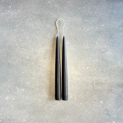 A pair of DANICA DESIGNS HAND-DIPPED TAPER CANDLES creating a stunning display at Gestalt Haus.